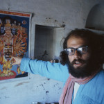 allen ginsberg kolkata BENARES, INDIA - FEBRUARY 1963: Beat poet Allen Ginsberg points at art poster during February 1963 in his tenement apartment near the banks of the Ganges river in Benaras, India. Ginsberg explored Eastern philosophies with Peter Orlovsky and other founders of the Beat movement during his March '62 - May '63 stay. (Photo by Pete turner/Getty Images)