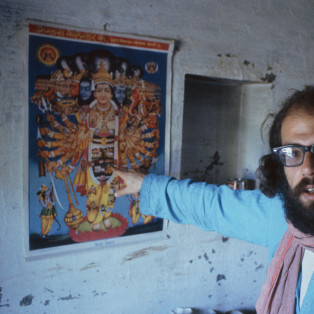 allen ginsberg kolkata BENARES, INDIA - FEBRUARY 1963: Beat poet Allen Ginsberg points at art poster during February 1963 in his tenement apartment near the banks of the Ganges river in Benaras, India. Ginsberg explored Eastern philosophies with Peter Orlovsky and other founders of the Beat movement during his March '62 - May '63 stay. (Photo by Pete turner/Getty Images)