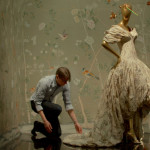 first monday in may, man working on a dress on a mannequin