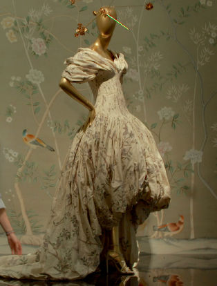 first monday in may, man working on a dress on a mannequin