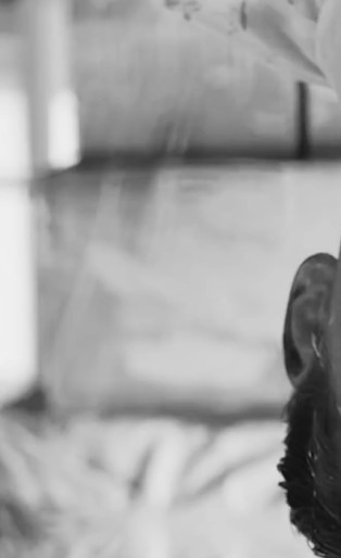 Tom Hiddleston upside down with paint on his face