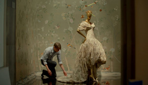 first monday in may, man working on a dress on a mannequin