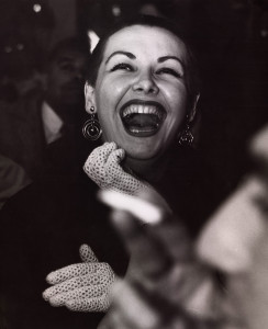 A woman in the audience laughs during a performance in Greenwich Village, New York City, circa 1955. (Photo by Weegee (Arthur Fellig) / International Center of Photography / Getty Images)