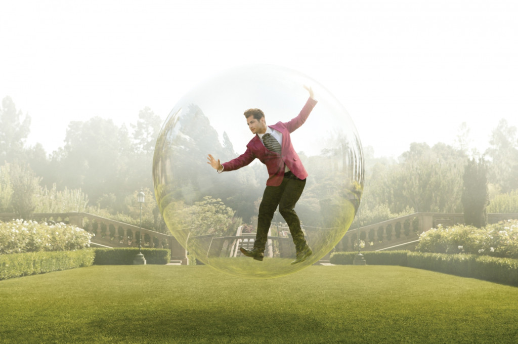 cade martin photography, male model floating in a bubble over a field