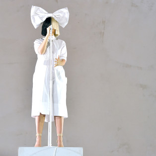 INDIO, CA - APRIL 17: Sia (L) and dancer perform onstage during day 3 of the 2016 Coachella Valley Music And Arts Festival Weekend 1 at the Empire Polo Club on April 17, 2016 in Indio, California. (Photo by Kevin Winter/Getty Images for Coachella)