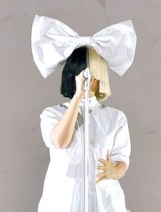 INDIO, CA - APRIL 17: Sia (L) and dancer perform onstage during day 3 of the 2016 Coachella Valley Music And Arts Festival Weekend 1 at the Empire Polo Club on April 17, 2016 in Indio, California. (Photo by Kevin Winter/Getty Images for Coachella)