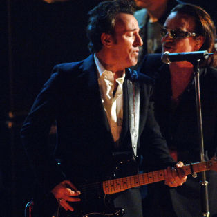 Bruce Springsteen, presenter, with Bono of U2, inductee (Photo by Jeff Kravitz/FilmMagic)