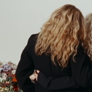 Proenza Schouler's video, women with their backs to us and their arms around each other