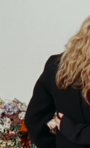 Proenza Schouler's video, women with their backs to us and their arms around each other