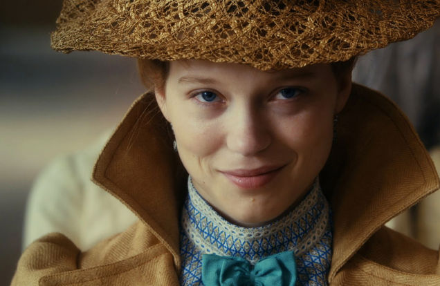 diary of a chambermaid movie, Jeanne Moreau wearing a beige hat and coat, with a blue bowtie