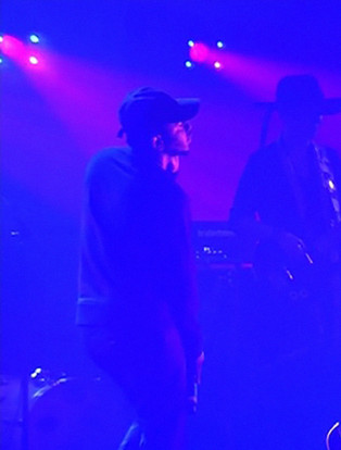 prince and kendrick lamar performing together on stage in purple lighting