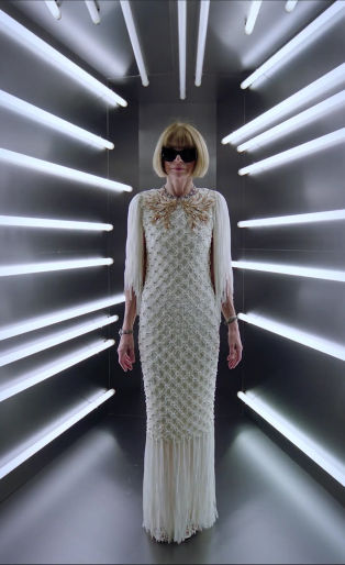 anna wintour in white dress surrounded by white lights
