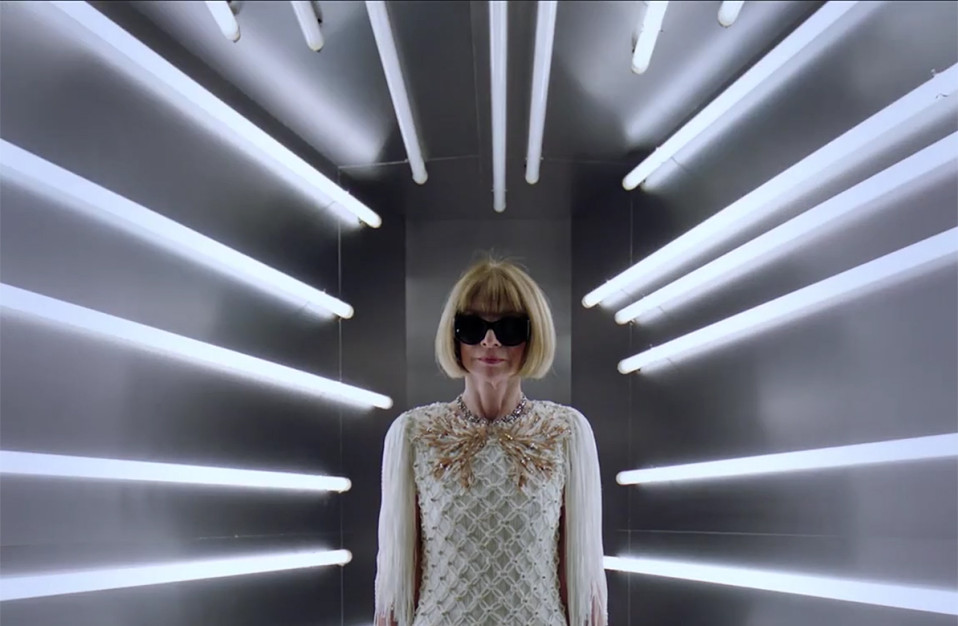 anna wintour in white dress surrounded by white lights