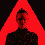 neon demon movie, elle fanning in red triangle and red light wearing a black dress