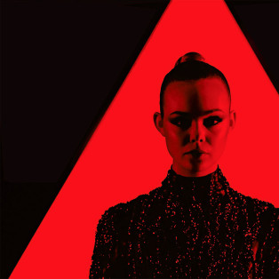 neon demon movie, elle fanning in red triangle and red light wearing a black dress