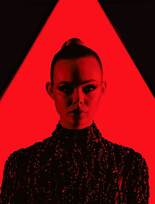 neon demon movie, elle fanning in red triangle and red light wearing a black dress