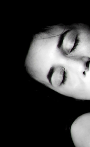 black and white portrait of man and woman havin sex, man kissing womans neck