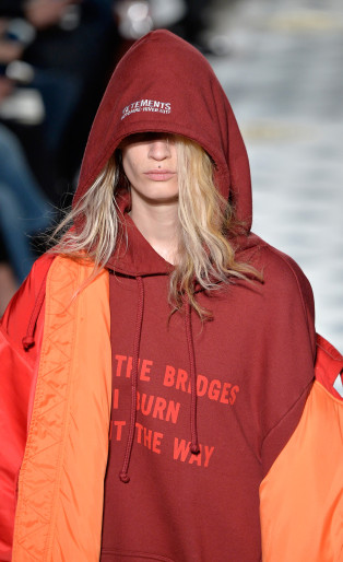 kering fashion show, blone male model wearing oversized jacket and hoodie