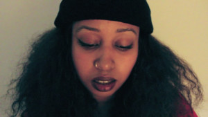 warsan shire portrait, lemonade poet, woman with nose ring and beanie