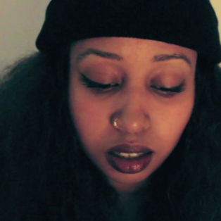 warsan shire portrait, lemonade poet, woman with nose ring and beanie
