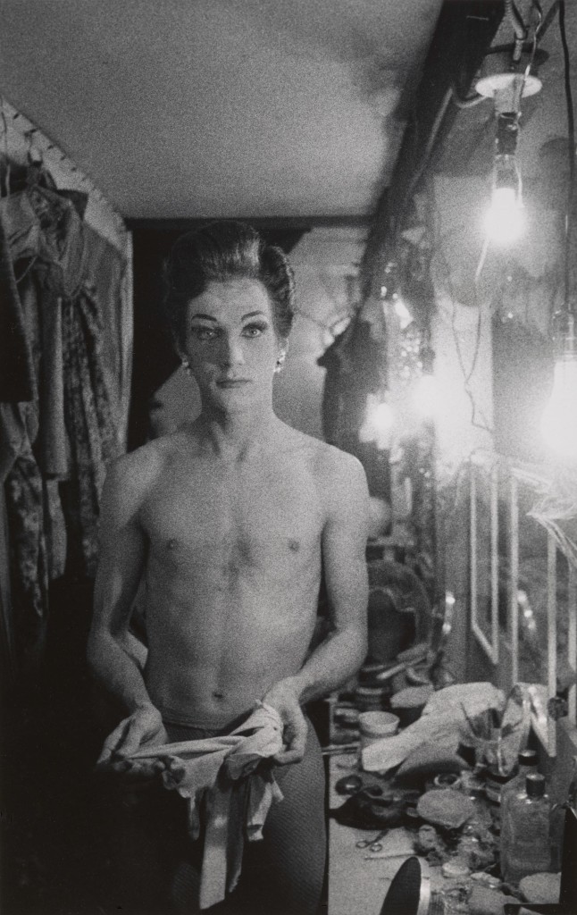 Diane Arbus. Female impersonator holding long gloves, Hempstead, L.I. 1959. ©The Estate of Diane Arbus, LLC. All Rights Reserved
