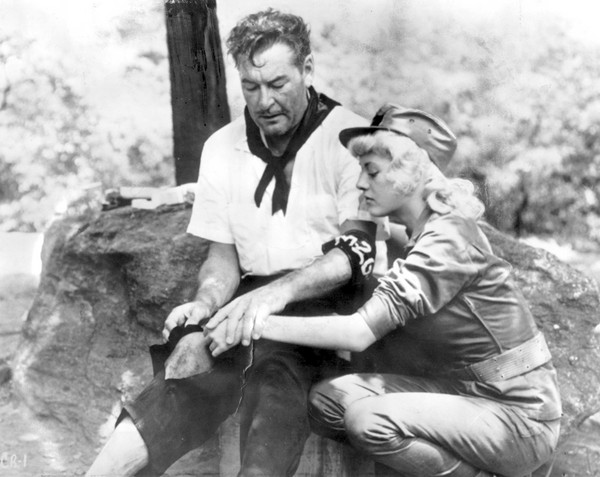 Errol Flynn and Beverly Aadland during the filming of "Cuban Rebel Girls," Flynn's last film. Photo by The Associated Press.