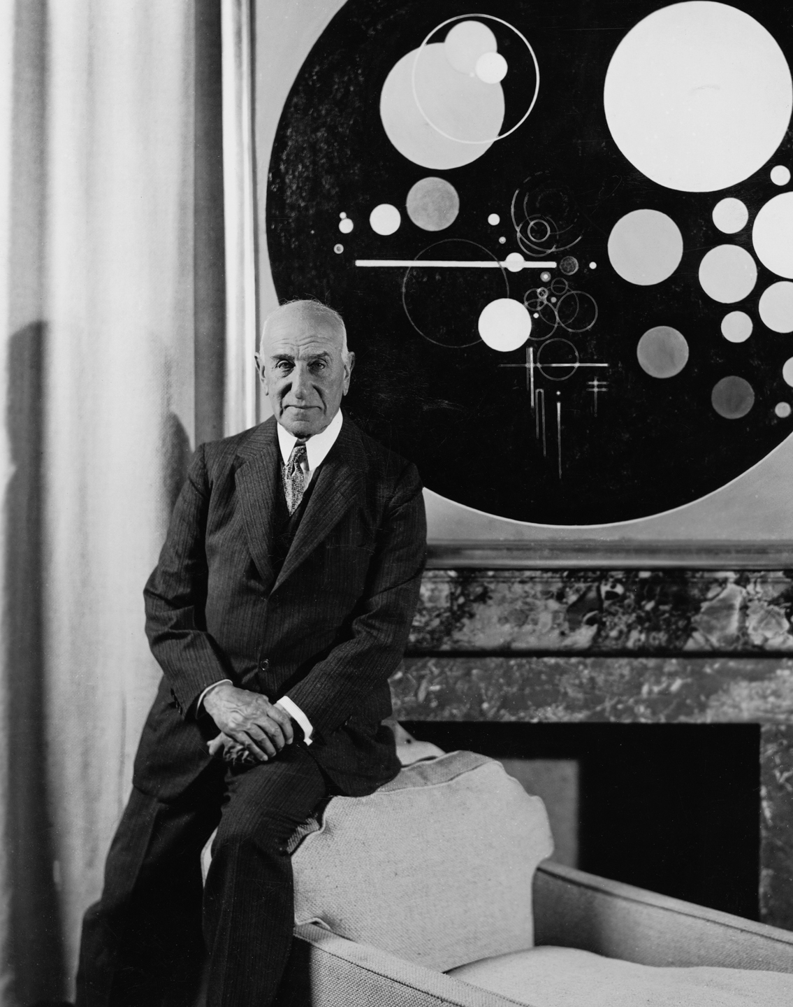 Solomon R. Guggenheim at the Plaza Hotel, New York, c. 1937, with Rudolf Bauer’s Andante (from Tetraptychon: Symphony in Four Movements, 1926–30). Photo: Underwood and Underwood Studios, New York, courtesy HvRF Archives.
