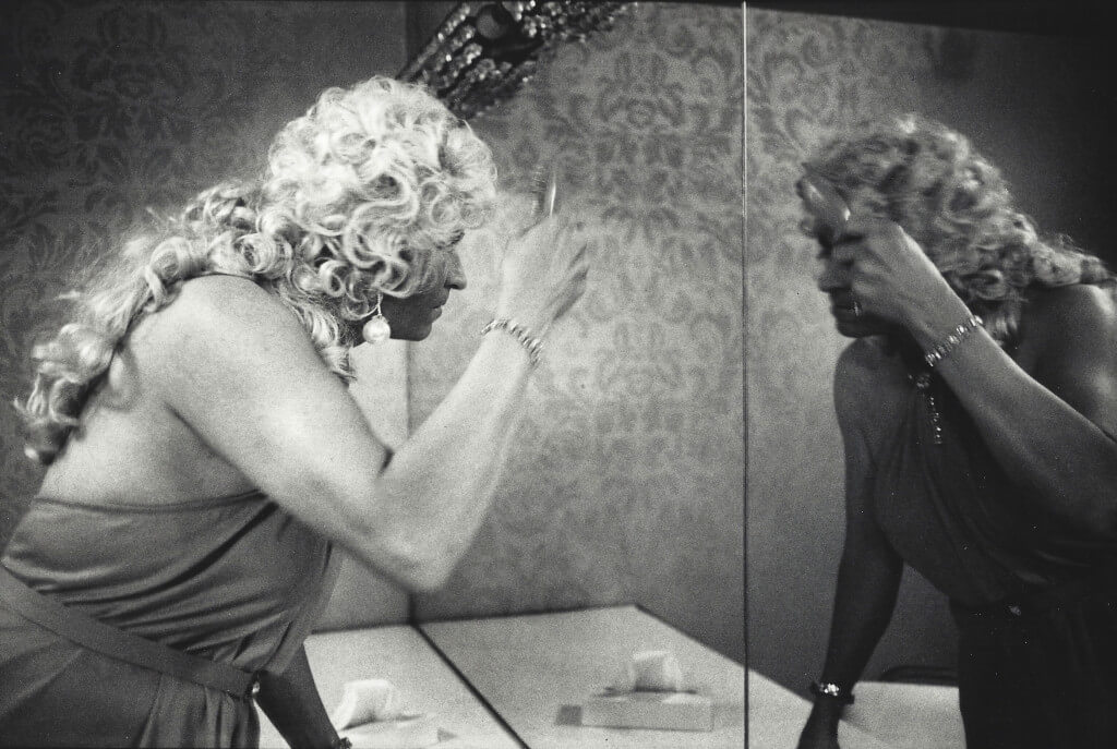 Drag Queen in Mirror, Long Beach, 1971. Vintage gelatin silver print. 11 x 14”.