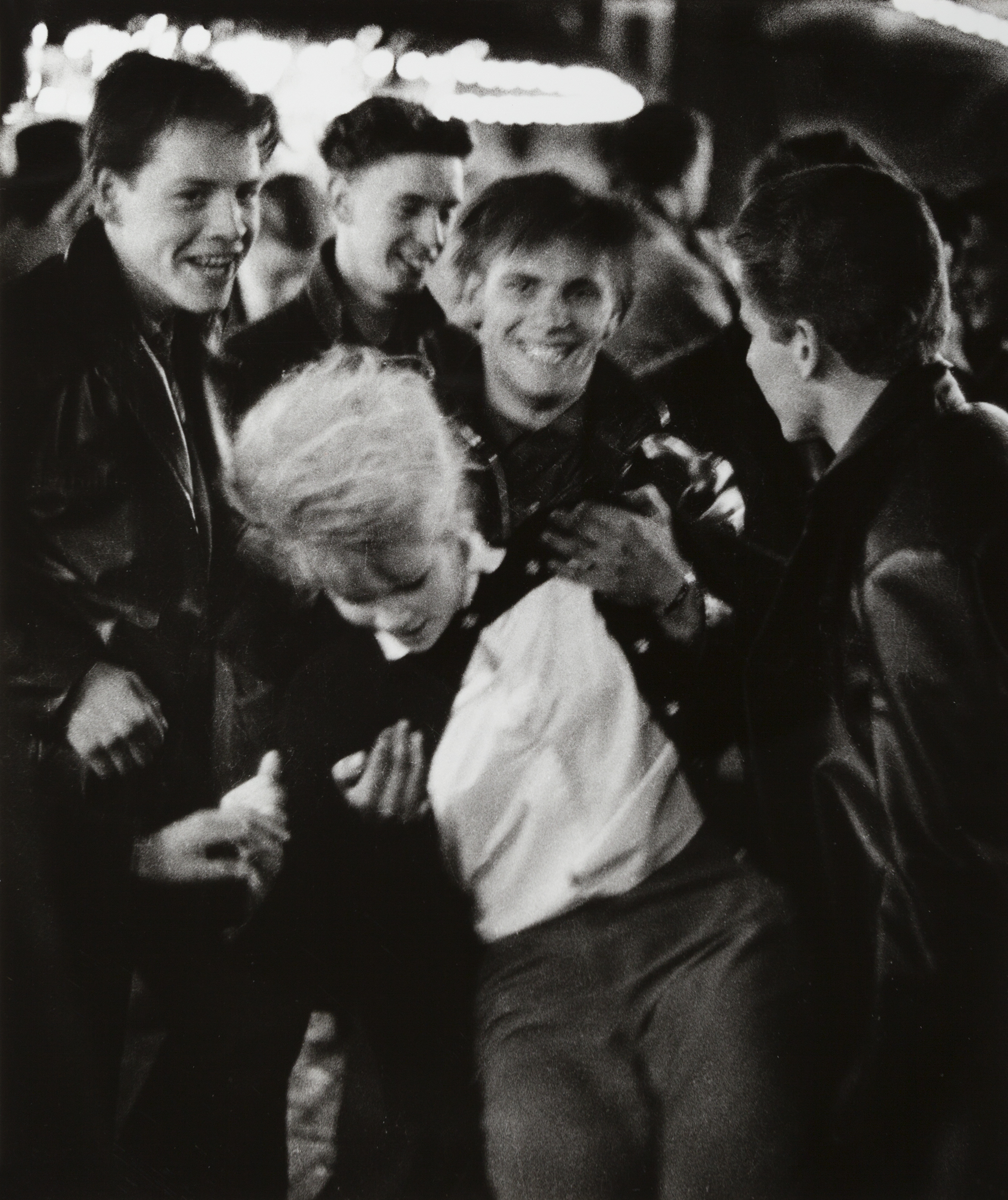 Nieuwmarkt Fair, Amsterdam (1963) by Ed van der Elsken. Nederlands Fotomuseum / © Ed van der Elsken / Collection Ed van der Elsken estate.