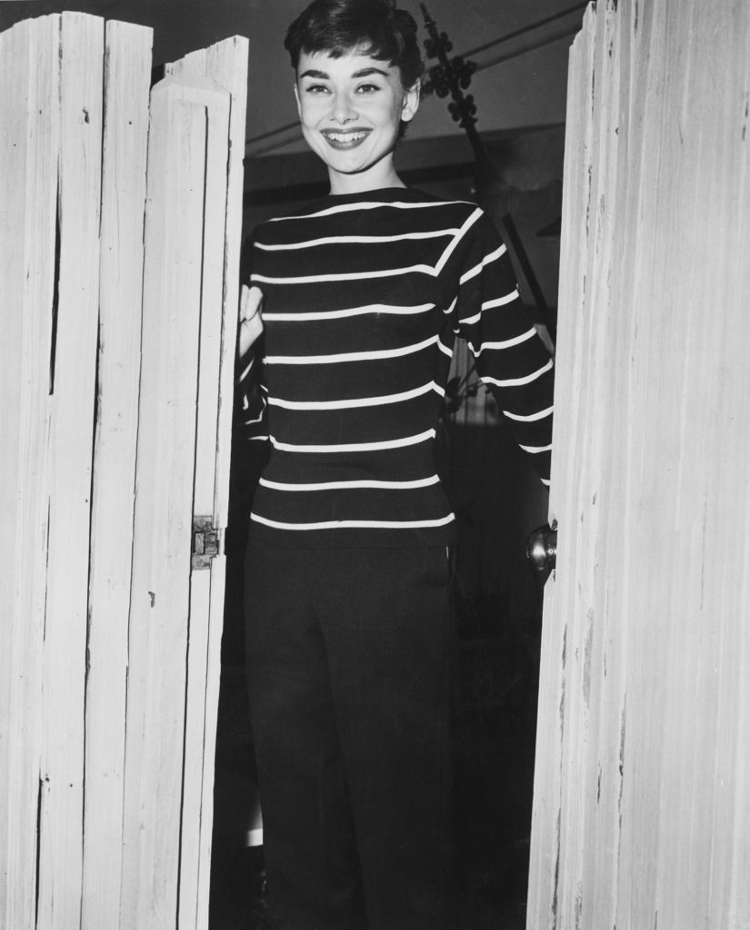 Audrey Hepburn wearing a Breton wool sweater originally worn by the fishermen from Brittany.
