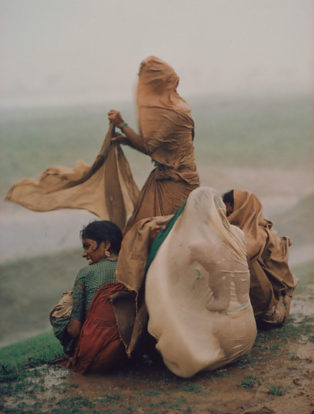 Raghubir Sing photograph of women caught in monsoon rain storm