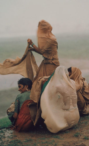Raghubir Sing photograph of women caught in monsoon rain storm