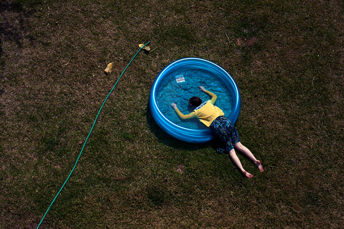 Oblivion by Ransom Ashley Face Down in blue kiddie pool