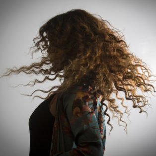 H.E.R. hair twirl