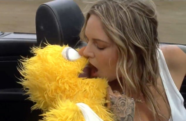 Tove Lo kissing muppet in car