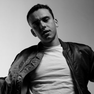 Ryan Jay black jacket white tshirt