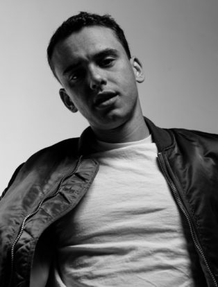 Ryan Jay black jacket white tshirt