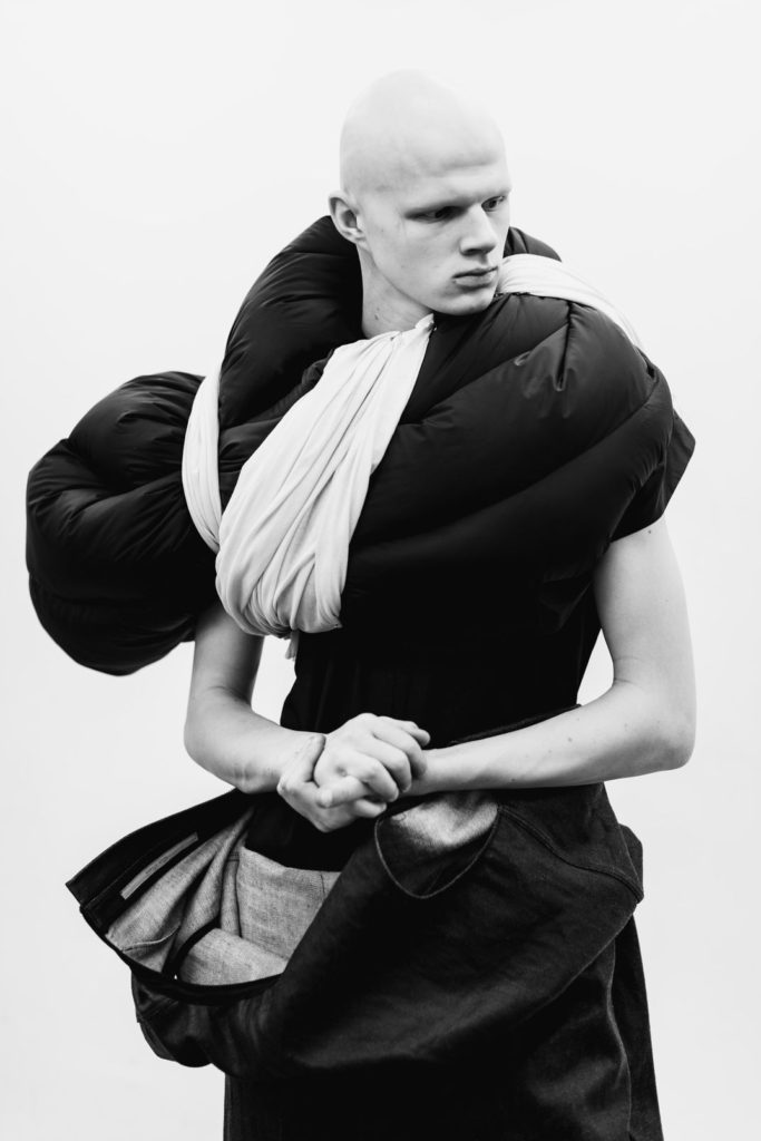 Rick Owens Male Model Draped in a Down Coat from Fall 2017 Runway Show