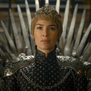 Photo of Lena Headey as Cersei Lannister, the sexiest female villian in HBO Series Game of Thrones- sitting on the throne with short cropped blonde hair wearing a crown.
