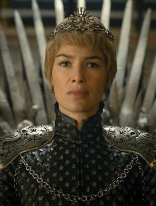 Photo of Lena Headey as Cersei Lannister, the sexiest female villian in HBO Series Game of Thrones- sitting on the throne with short cropped blonde hair wearing a crown.