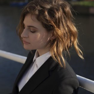 Christine Aguilera white shirt black jacket