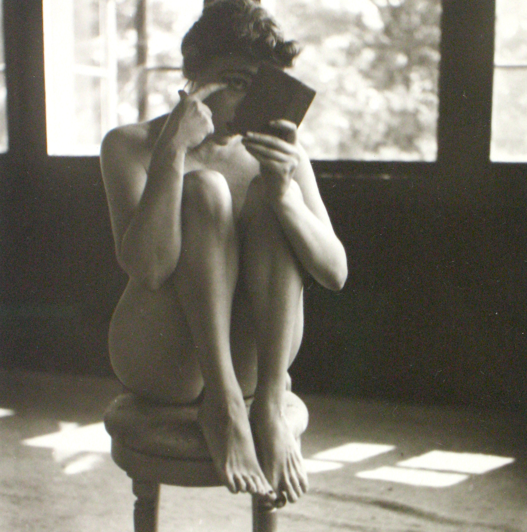 Saul Leiter woman sitting on chair nude