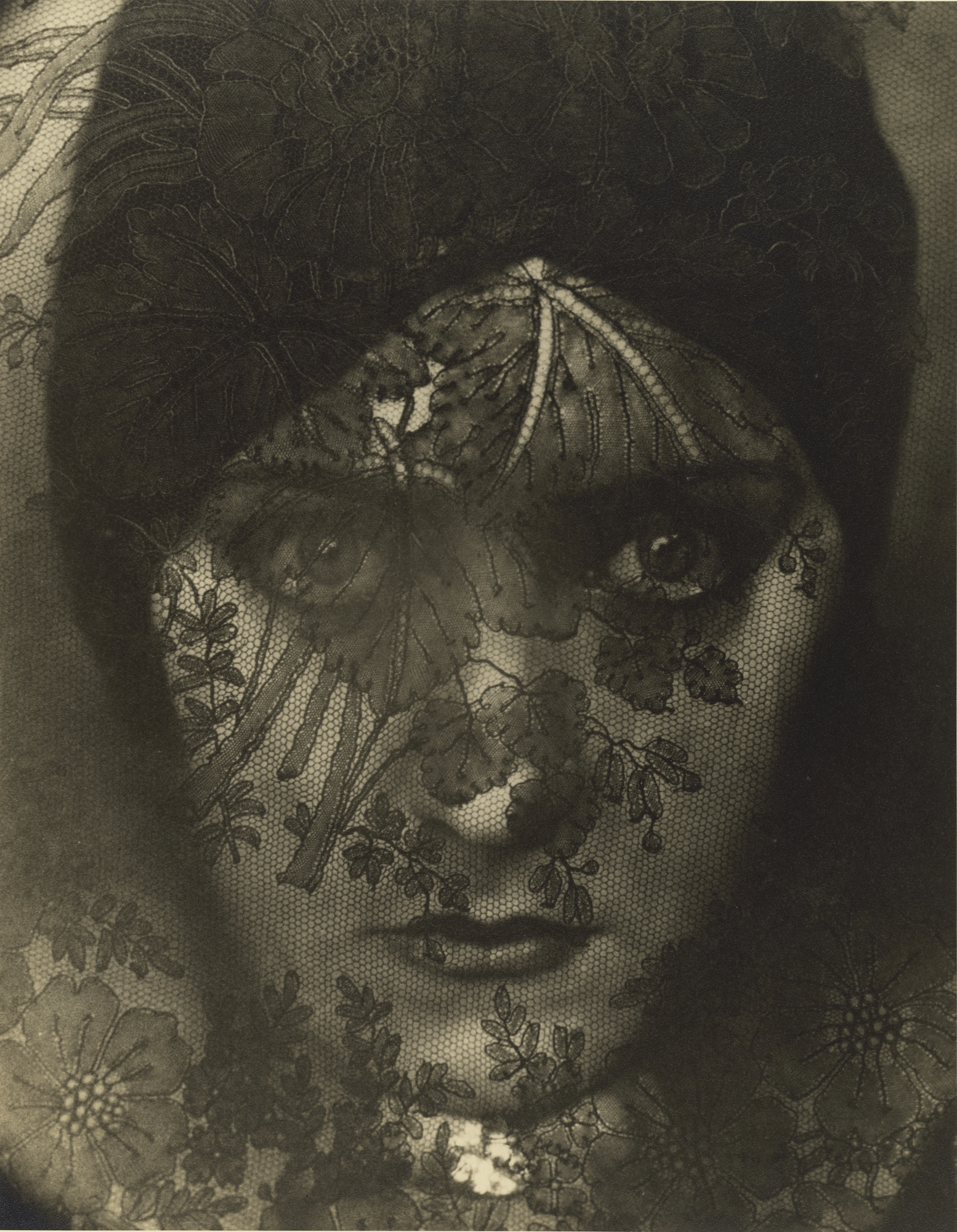 woman in lacy black veil