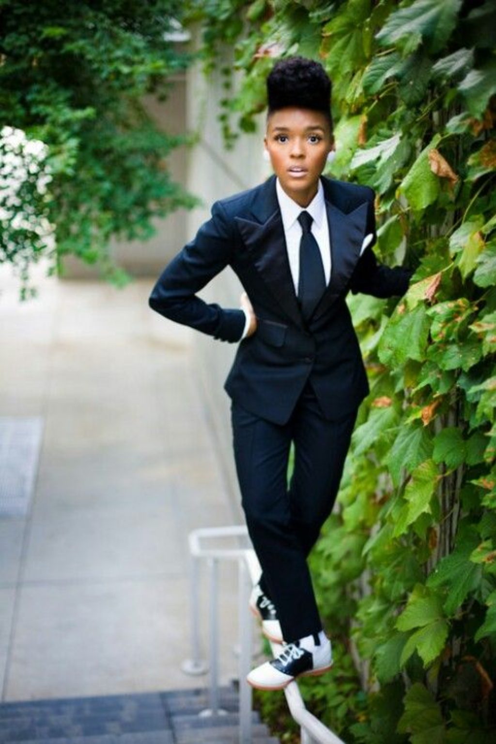 Janelle Monae in blue suit and tie