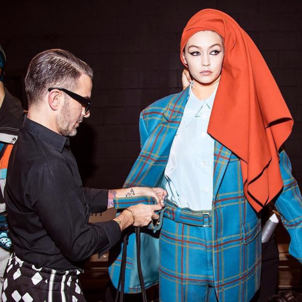 Marc Jacobs fixing Gigi Hadid's belt