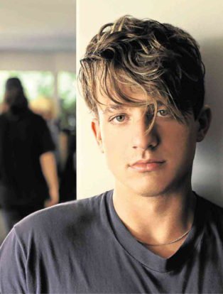 Charlie Puth in grey t-shirt