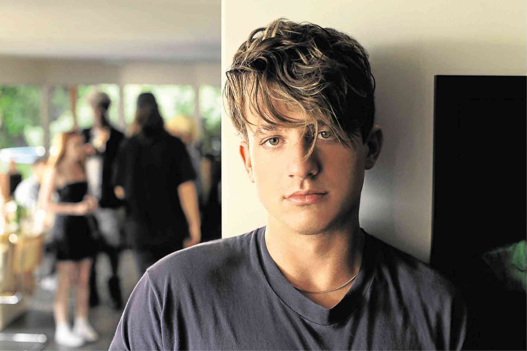 Charlie Puth in grey t-shirt