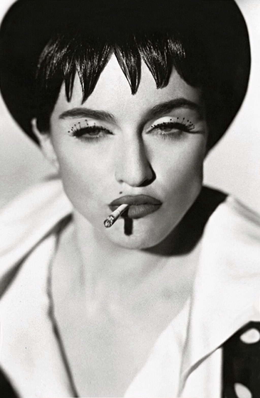 Photograph of Madonna Smoking A Cigarette Wearing Huge False Eyelashes 