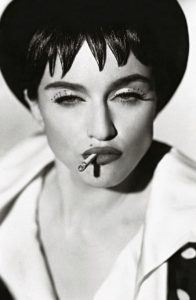 Photograph of Madonna Smoking A Cigarette Wearing Huge False Eyelashes