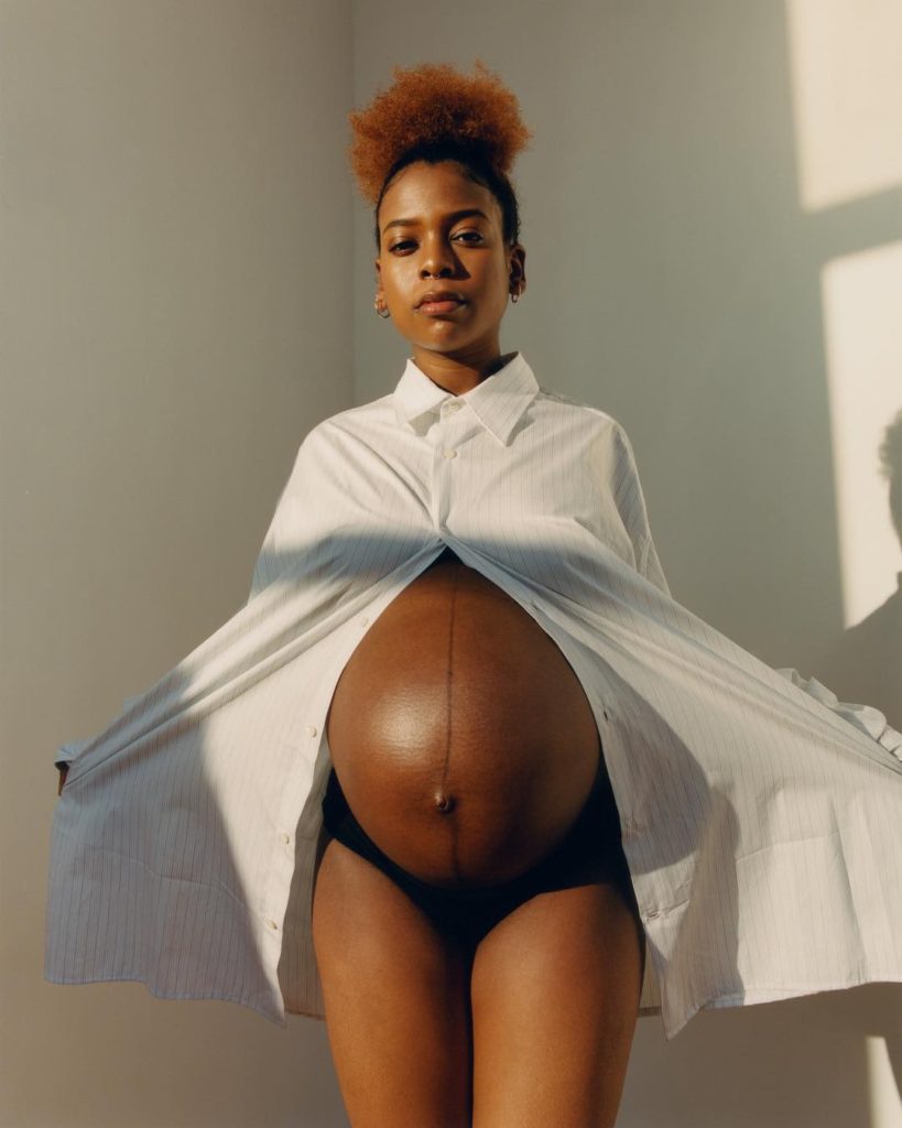 Tyler Mitchell Photograph of a Very Pregnant Woman with Short Red Afro